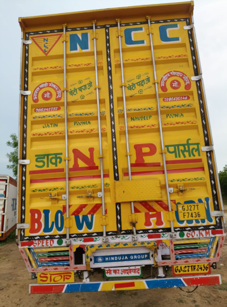 Navdeep Cargo Carrier truck, rear view, hand-painted signage